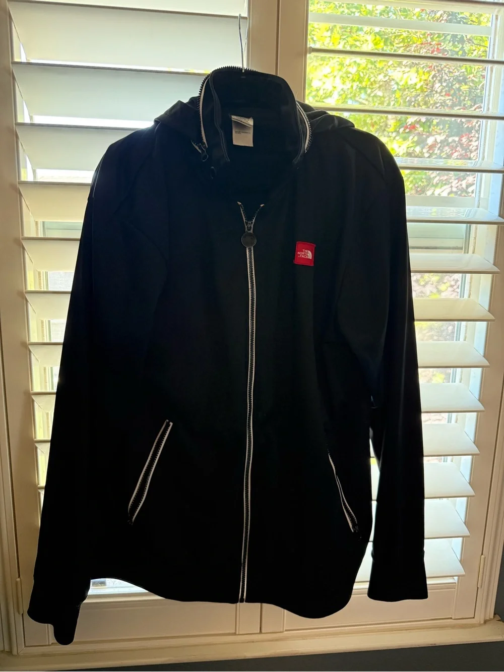 The North Face Black Jacket with Red Logo Patch